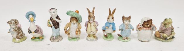 Group of nine Beswick pottery Beatrix Potter figures including Tom Kitten, Jeremy Fisher, Mrs