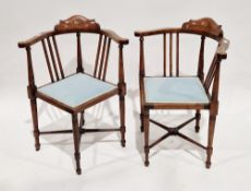 Pair of Edwardian mahogany corner chairs, the top rails inlaid with a roundel of tulips, string