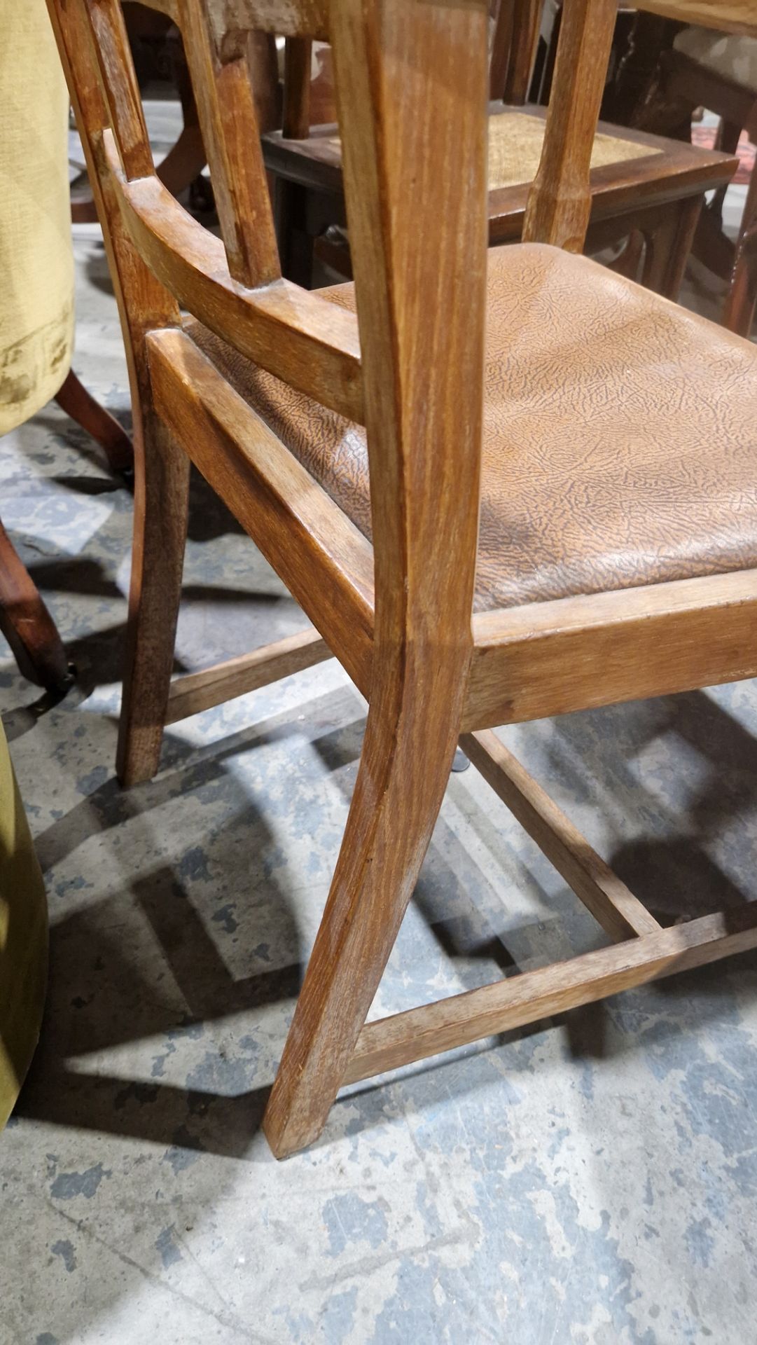 In the manner of the Cotswold School an Arts and Crafts pale oak elbow chair with lattice back, - Image 10 of 14