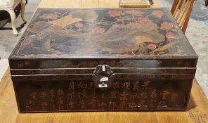 Black lacquered trunk in the 19th century Chinese export style, the hinged lid decorated in gilts