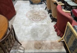 Large cream ground Chinese superwash carpet with central floral motif, single floral border, 368cm x