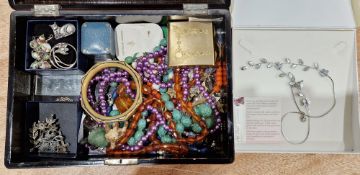 Japanese lacquered box containing a quantity of costume jewellery including a silver art nouveau