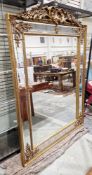 Large 19th century giltwood mirror in the French rococo manner, the foliate scroll floral and