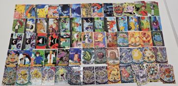 Approximately 130 Pokemon Topps cards with several foil versions to include 