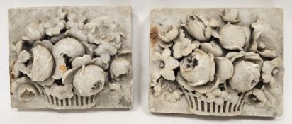 Pair of white marble carved relief plaques depicting flowers in a basket, each 22cm x 18cm