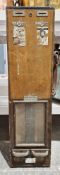 Early 20th century wooden cased wall hanging cigarette vending machine with the remnants of labels