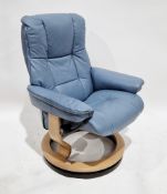 Ekornes Stressless recliner armchair upholstered in blue leather, on pale oak veneer circular swivel