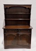 20th century dark oak dresser in the 17th century style, the upper section with two plate shelves