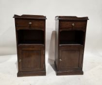 Two matching early 20th century mahogany pot cupboards, each with galleried rails to top, over a