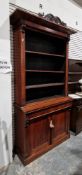 19th century rosewood open library bookcase cupboard, the moulded top with foliate scroll carved