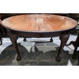 Late Victorian mahogany oval wind-out extending dining room table in the Chippendale manner, the top