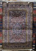 Gangotri midnight blue ground rug with floral field, spandrels and multiple herati and floral