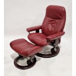 Ekornes stressless reclining armchair and matching footstool, red burgundy upholstery, on rosewood