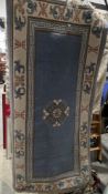Chinese blue ground superwash rug with central geometric medallion, multiple geometric borders,