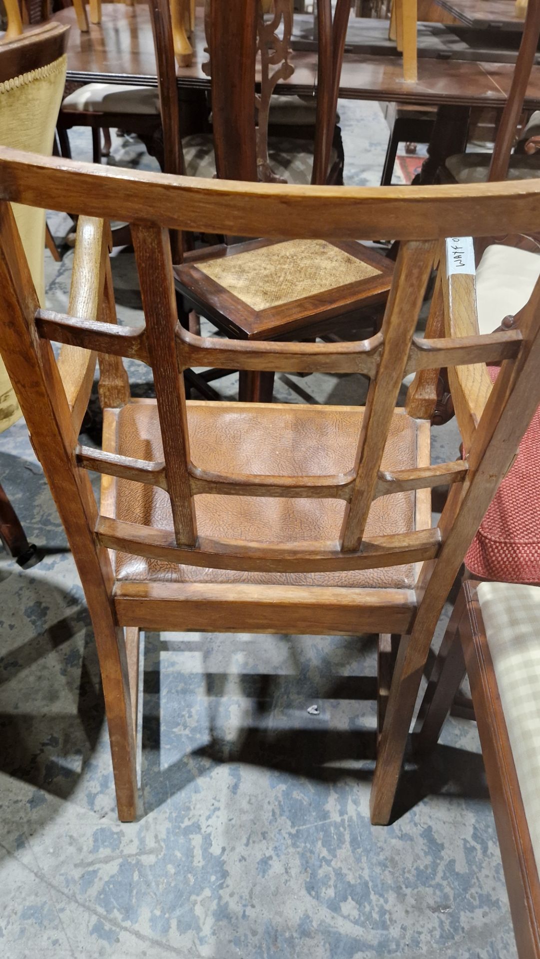 In the manner of the Cotswold School an Arts and Crafts pale oak elbow chair with lattice back, - Image 11 of 14