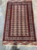 Eastern green ground rug with four rows of 15 elephant foot guls, multiple geometric borders flanked