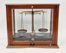 Set of laboratory scales by Griffin and Tatlock Ltd in glazed mahogany case