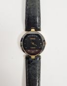 Rado Florence wristwatch, the round textured black dial with dot markers, in a gilt metal and