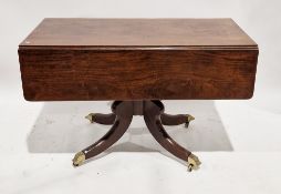 A Regency mahogany drop flap supper table of rectangular form, having a drawer to one end on a