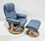Ekornes Stressless recliner armchair with matching footstool, upholstered in blue leather, on pale