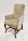 Early 20th century walnut armchair in the Queen Anne manner, upholstered in a pale fabric, on