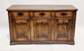 In the manner of Titchmarsh & Goodwin, an oak dresser base in the George lll style, the