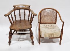 19th/early 20th century elm seated captain's-type tub chair with spindle back, saddle seat, on