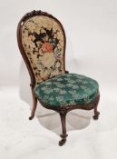 Victorian rosewood balloon back salon chair, with floral carved cresting, needlework upholstered