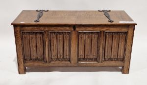 Oak coffer in the 18th century manner, the lid with iron strapwork hinges, opening to a pine plank