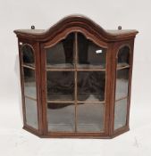 19th century oak hanging cabinet, the domed moulded central section over a glass single panel door