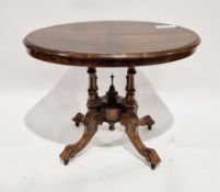 Victorian walnut small tilt-top centre/loo table, the oval quarter veneered top on four turned