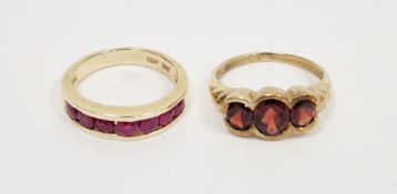 14 ct yellow gold and pink stone ring and a yellow metal and garnet set ring, the first stamped BH