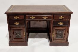 Late 19th/early 20th century mahogany twin-pedestal desk, the rectangular top with brown leather