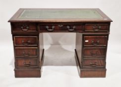 Mahogany twin-pedestal desk in the George III manner, the rectangular top with green leather inset