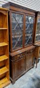 20th century mahogany-effect library bookcase in the George III manner, the upper section with