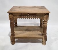 Modern mango wood side table having a single drawer and pierced decorative frieze on turned reeded
