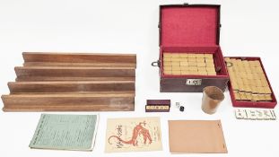 Early 20th century mah-jong set, the stitched leather case opening to two lift out trays holding 148