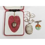 Silver locket on a silver chain, a silver heart-shaped locket on 9ct gold chain, and a silver and