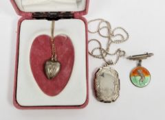 Silver locket on a silver chain, a silver heart-shaped locket on 9ct gold chain, and a silver and