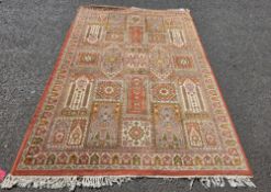 Large orange ground rug with geometric and floral grid pattern field, multiple geometric borders,