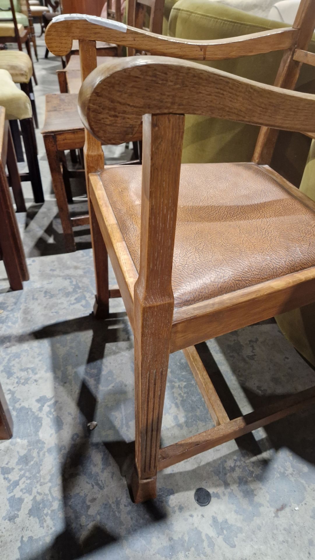In the manner of the Cotswold School an Arts and Crafts pale oak elbow chair with lattice back, - Image 6 of 14