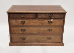 Early 20th century oak chest comprising two short and three long graduated cockbeaded drawers with