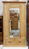 Late 19th century pitch pine wardrobe with single mirrored door opening to a hanging space over