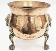 Early to mid-20th century copper log bucket of squat globular form with brass lion mask drop ring