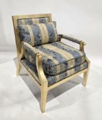 French-style armchair in the Louis XVI style, having a gold finish frame and blue and gold-