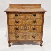 Early 20th century walnut veneered chest, the rectangular top with back upstand over four long