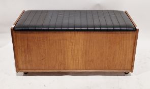 Mid-century teak ottoman or blanket box, the hinged lid with black vinyl padded upholstery, on