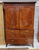 Early 19th century mahogany inlaid linenpress later converted to a wardrobe, the moulded cornice
