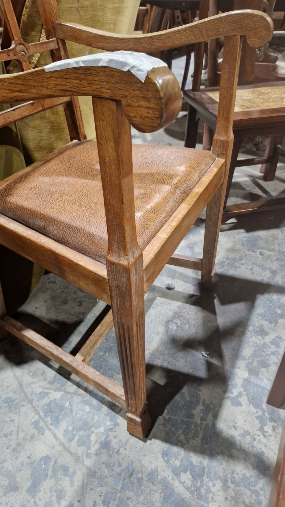 In the manner of the Cotswold School an Arts and Crafts pale oak elbow chair with lattice back, - Image 8 of 14