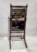 Mahogany cheval mirror in the Regency manner, the square plate held on a turned and block support